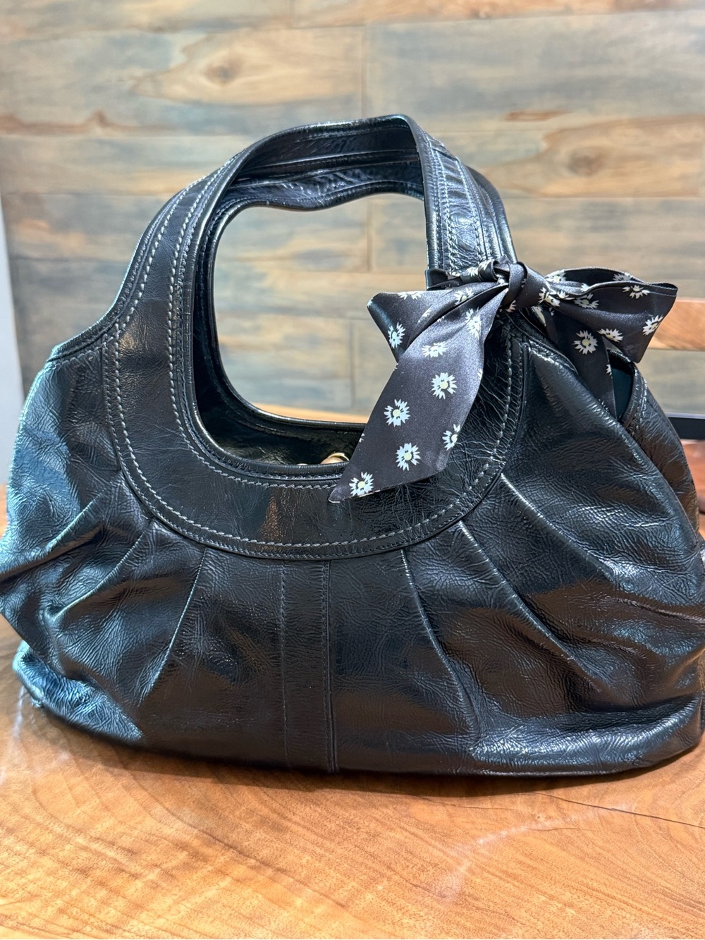 Coach Ergo Black Leather Satchel with Floral Bow Accent . Only callout on strap